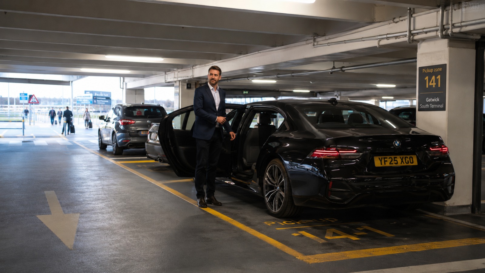 Black executive Gatwick airport taxi in South Terminal Express Pick Up zone at Car Park 3 Level 0 for long-haul arrivals.